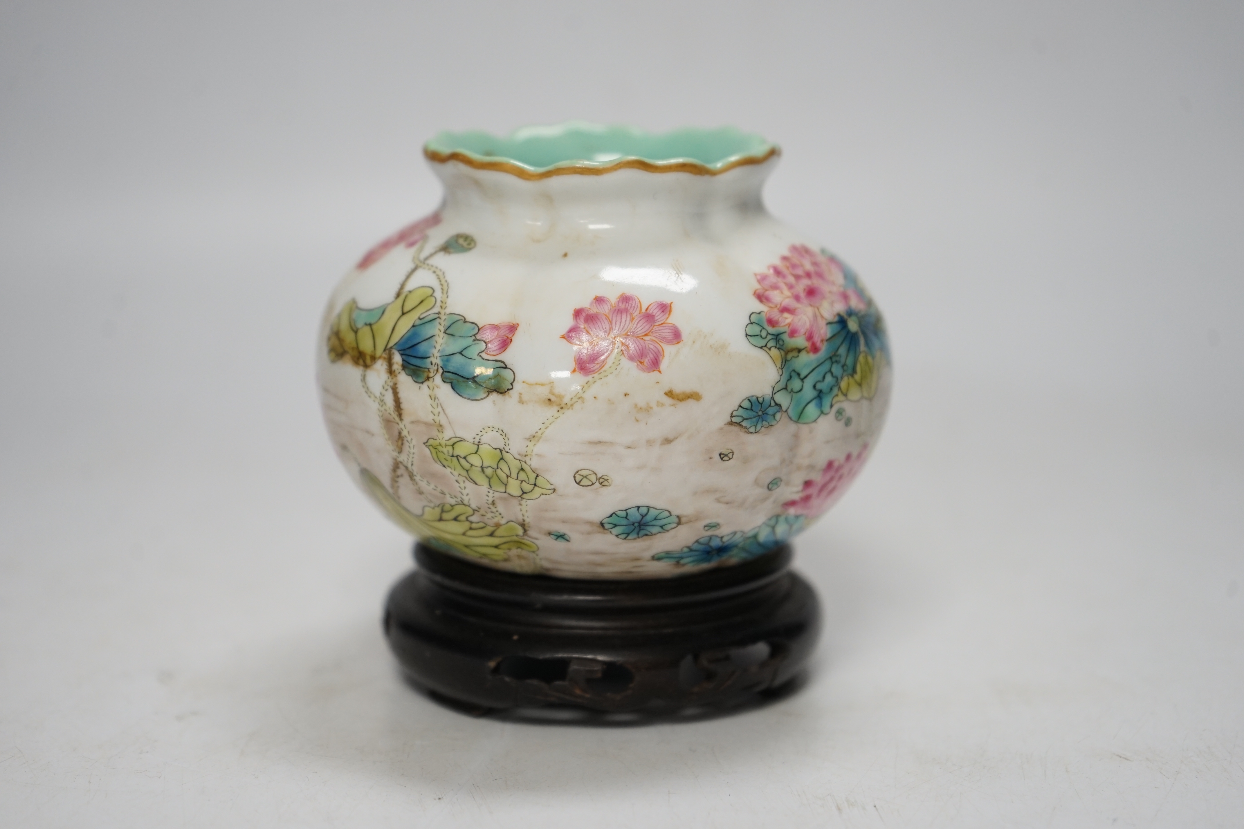 A Chinese famille rose water pot, Qianlong mark but later, on hardwood stand 9cm